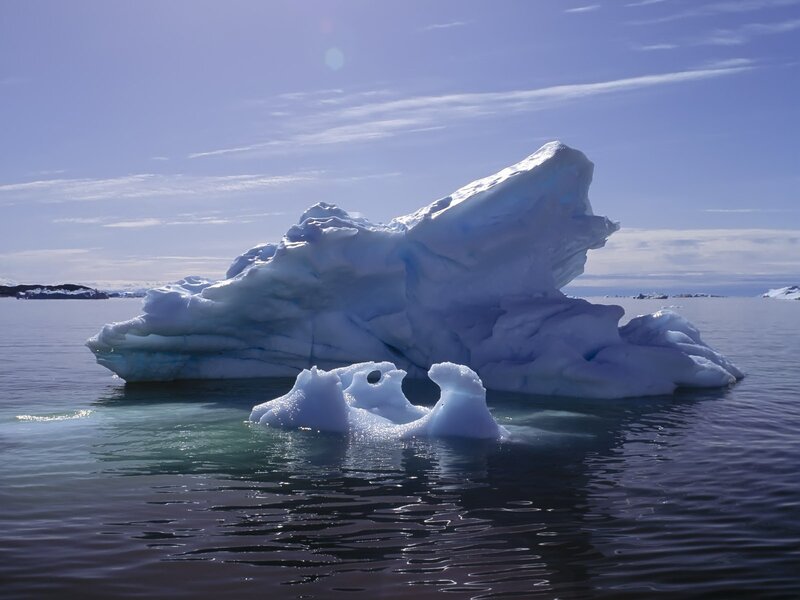 Iceberg floating in calm water
