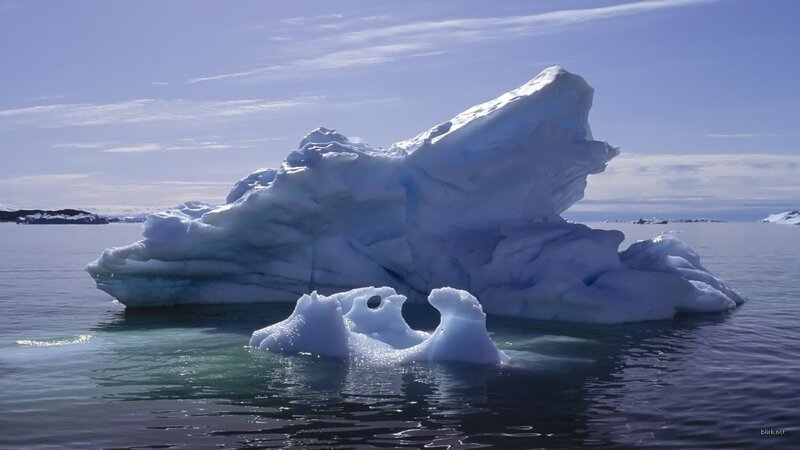 Iceberg floating in calm waters