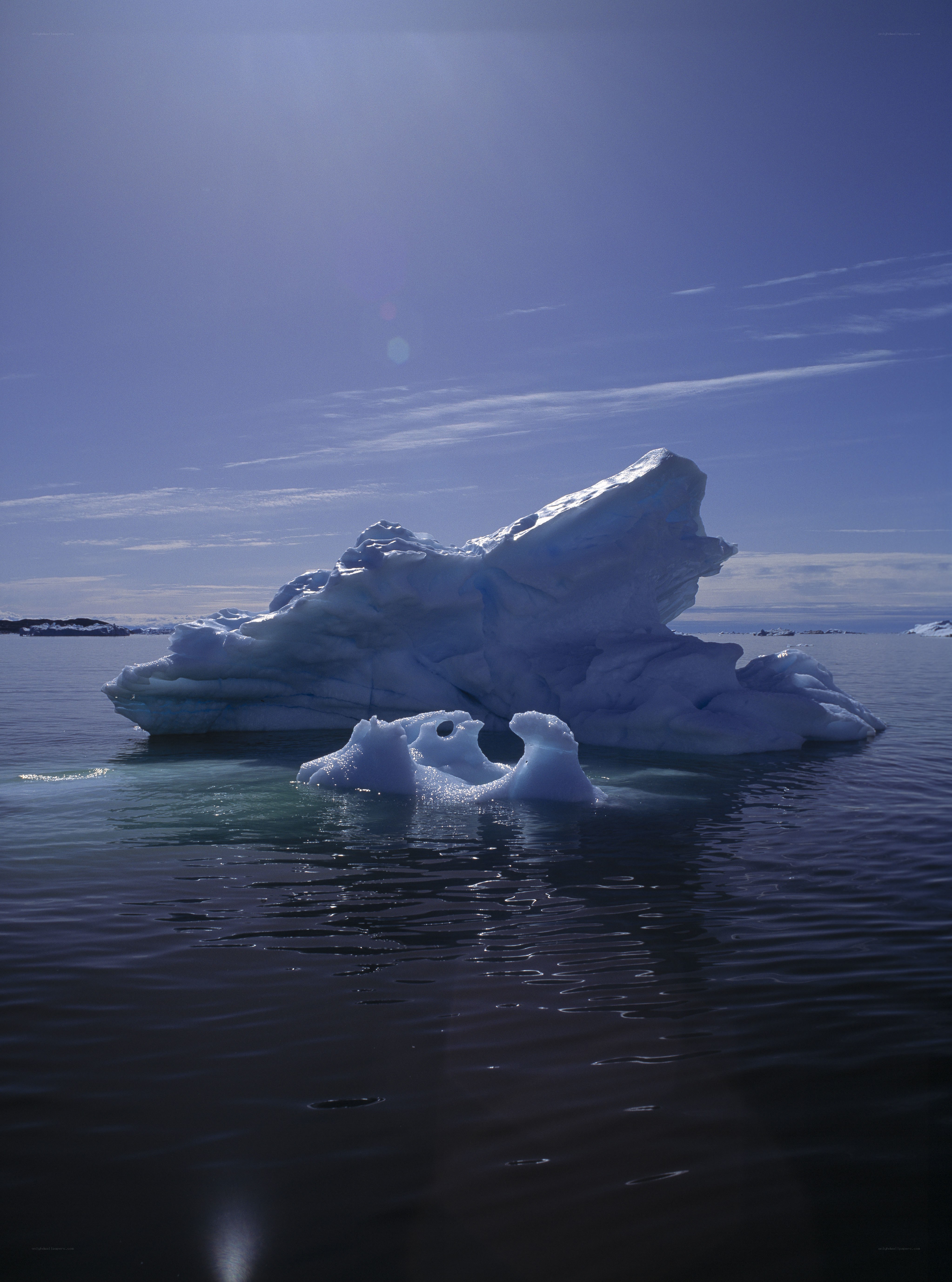 Iceberg floating in calm waters