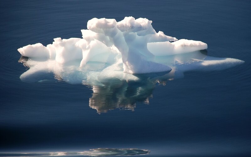 Iceberg Floating in Water — Blue