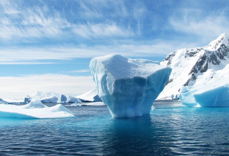 Iceberg in Blue Water — Serene, Afternoon, Photograph, Snow-covered Mountains