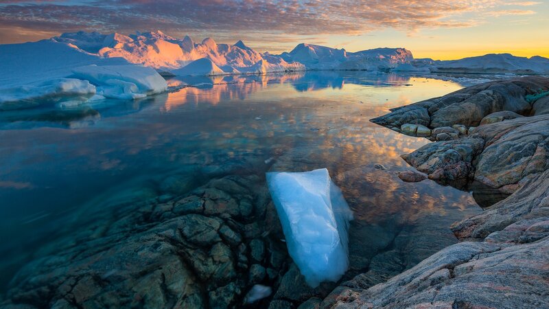 Iceberg in Calm Water — Blue, Serene, Sunset, Photograph, Icebergs