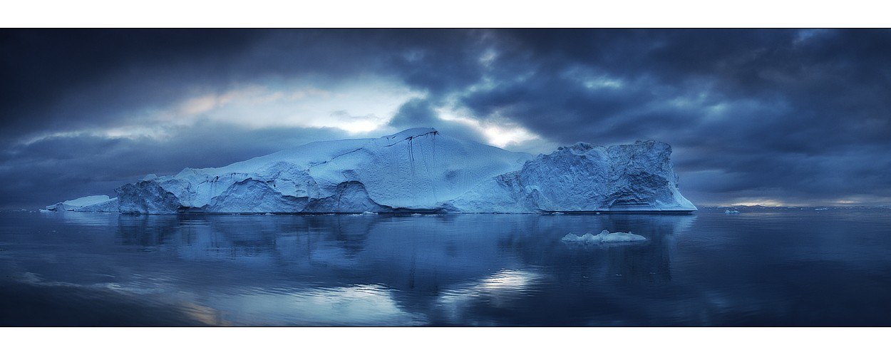 Iceberg in dark waters