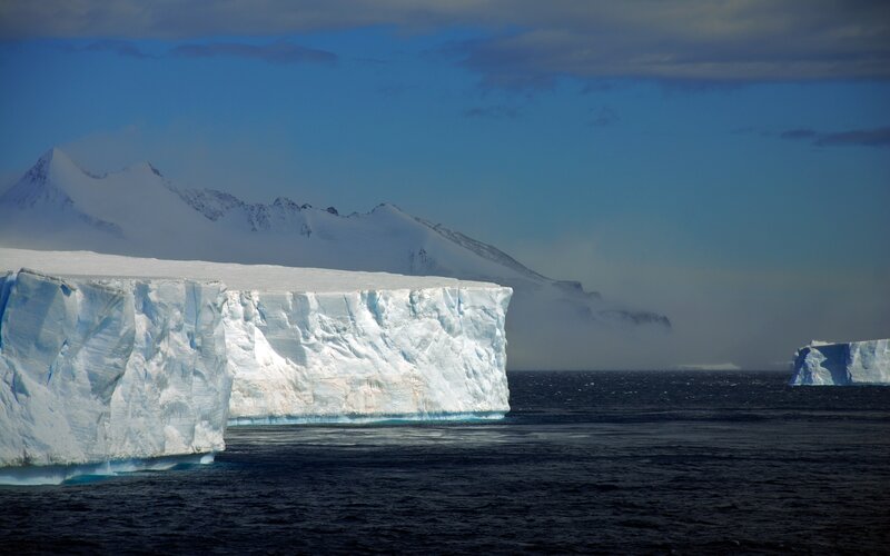 Iceberg in Ocean — Blue, Dramatic, Photograph, Mountains, Sea, Sky