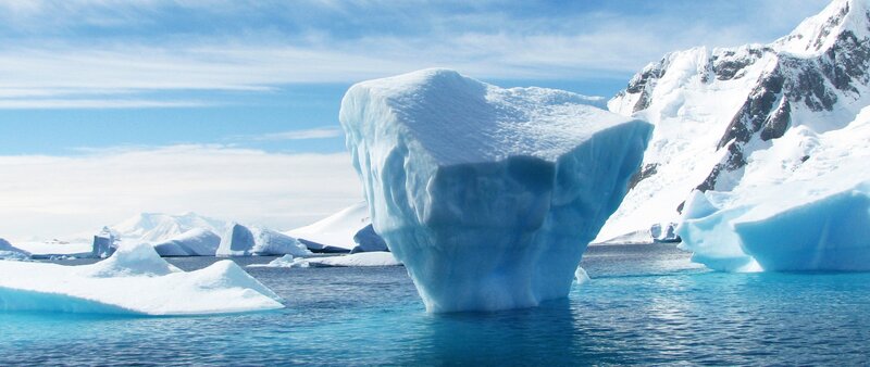 Iceberg in Ocean — Blue, Serene, Afternoon, Photograph, Icebergs