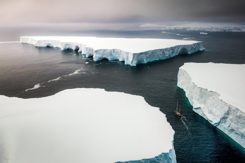 Iceberg in Ocean — White, Dramatic, Photograph, Boat