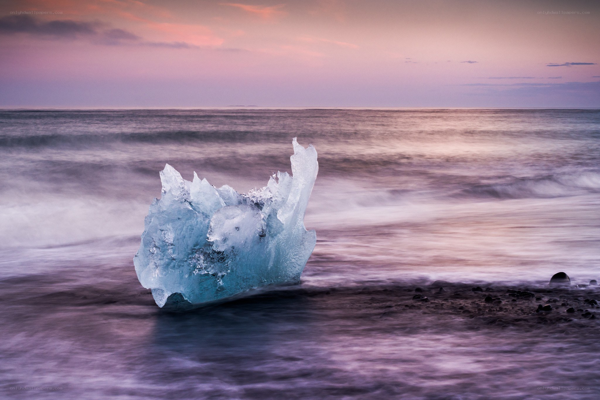 Iceberg on a purple beach