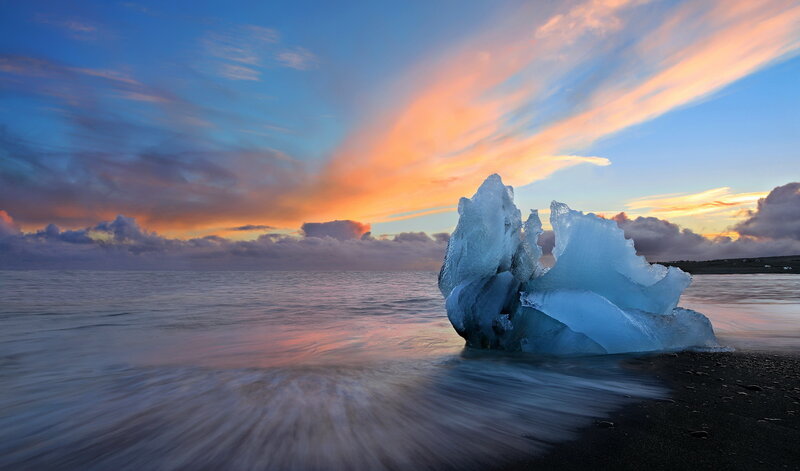 Iceberg on Black Sand Beach — Blue