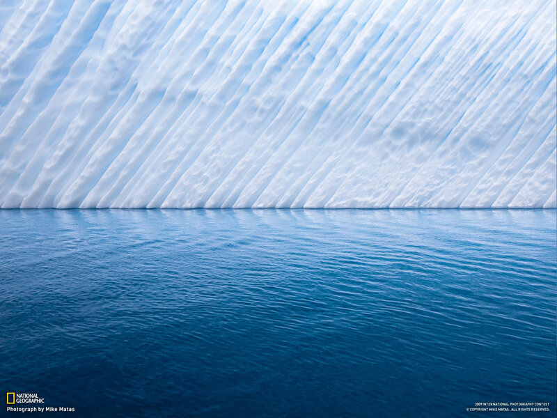 Iceberg with blue water