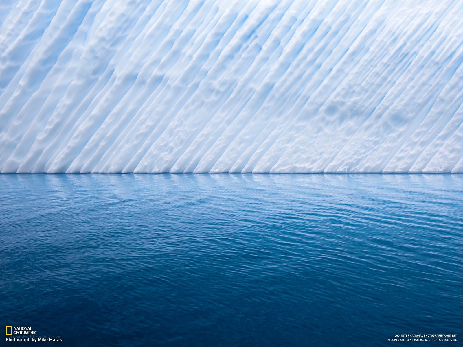 Iceberg with blue water