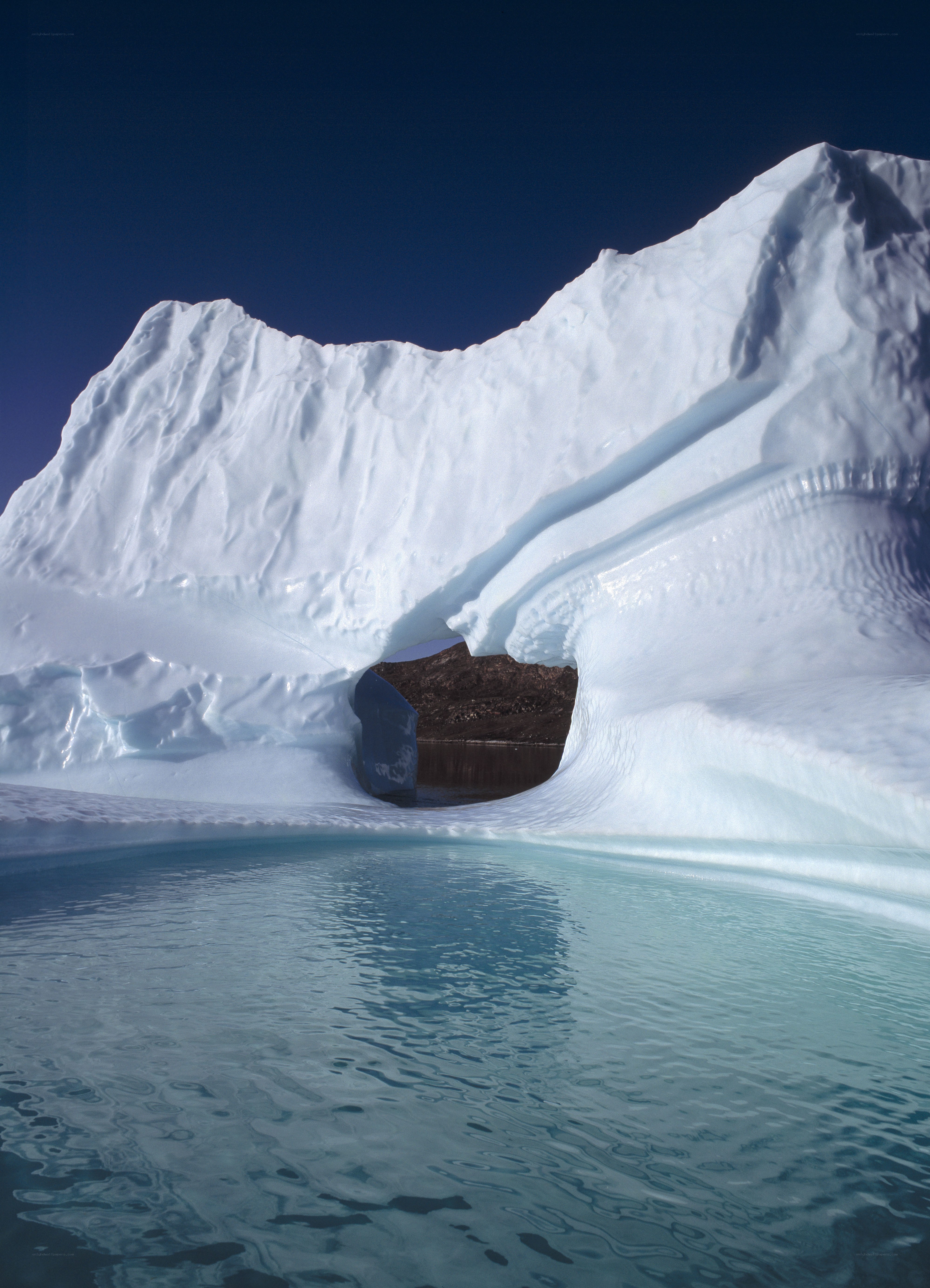 Iceberg with natural arch