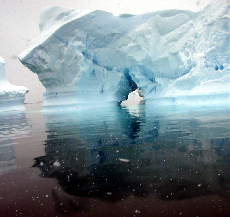 Iceberg with underwater reflection