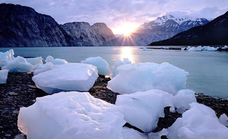 icebergs at sunset in a fjord