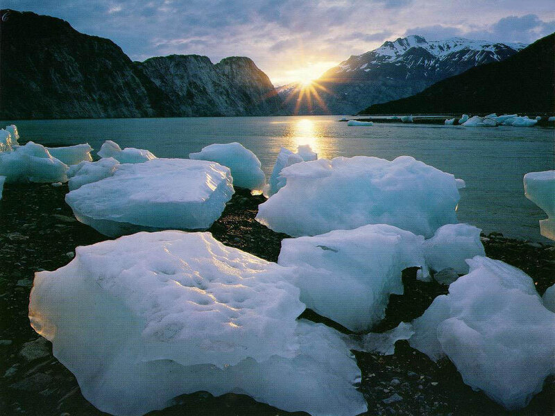 icebergs at sunset in a fjord