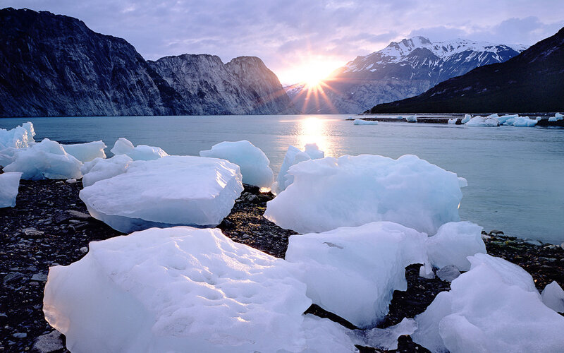 Icebergs at sunset in a fjord