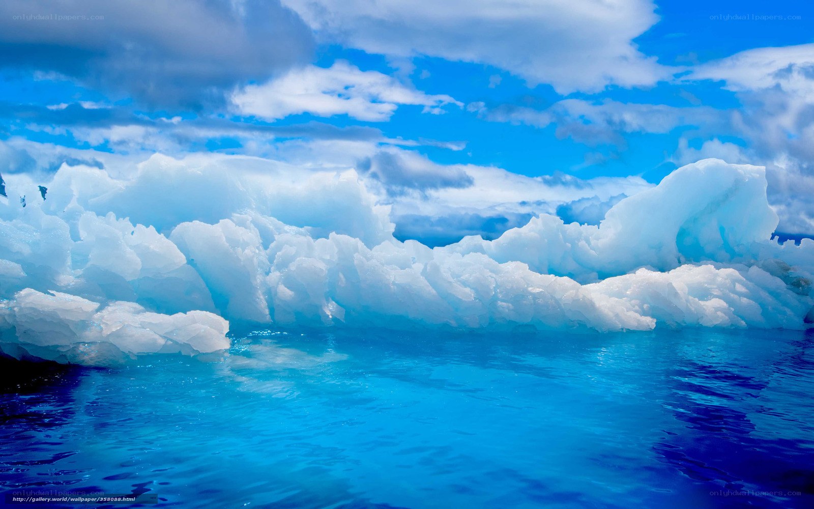 Icebergs floating in blue water