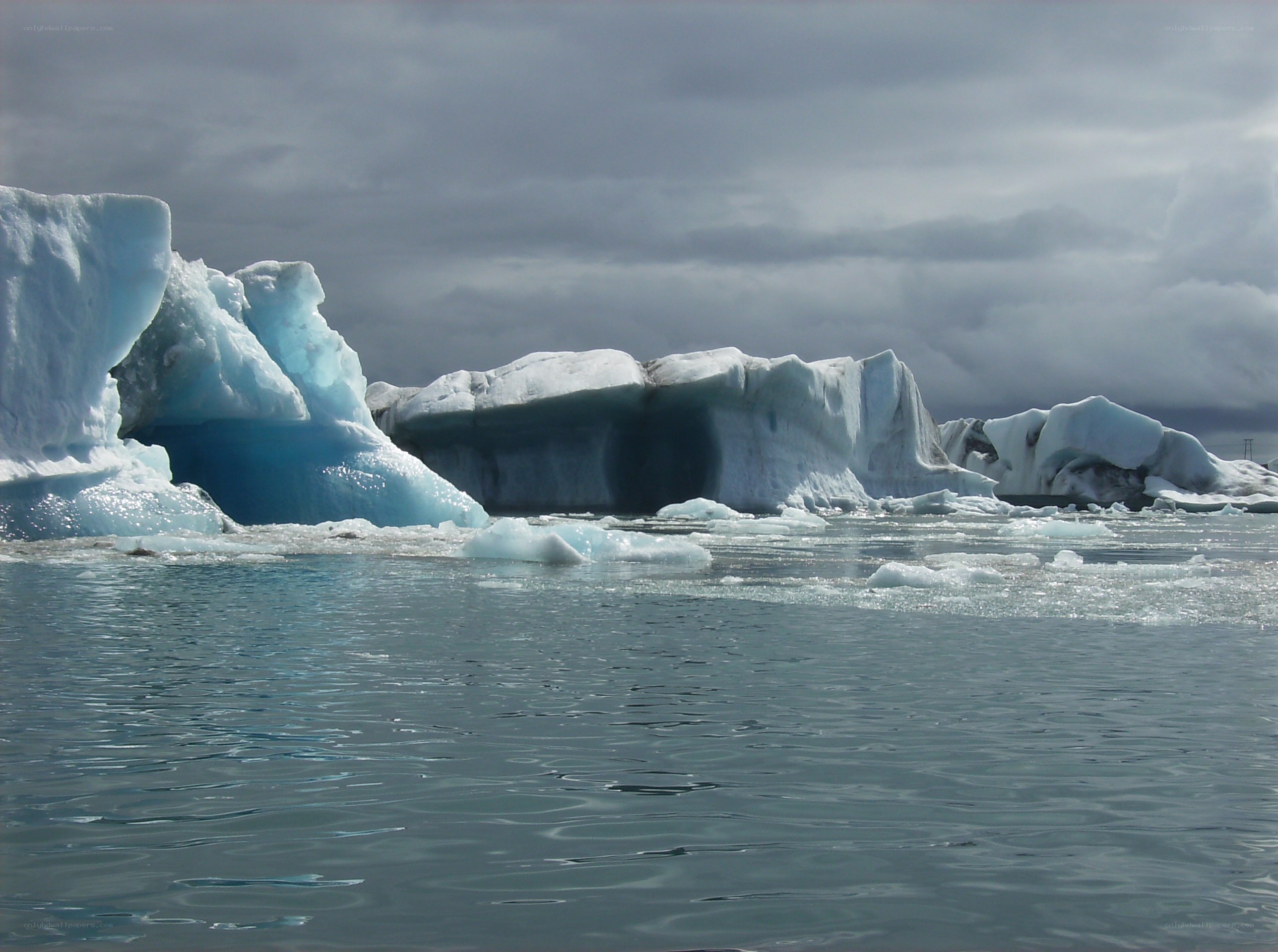 Icebergs floating in calm water