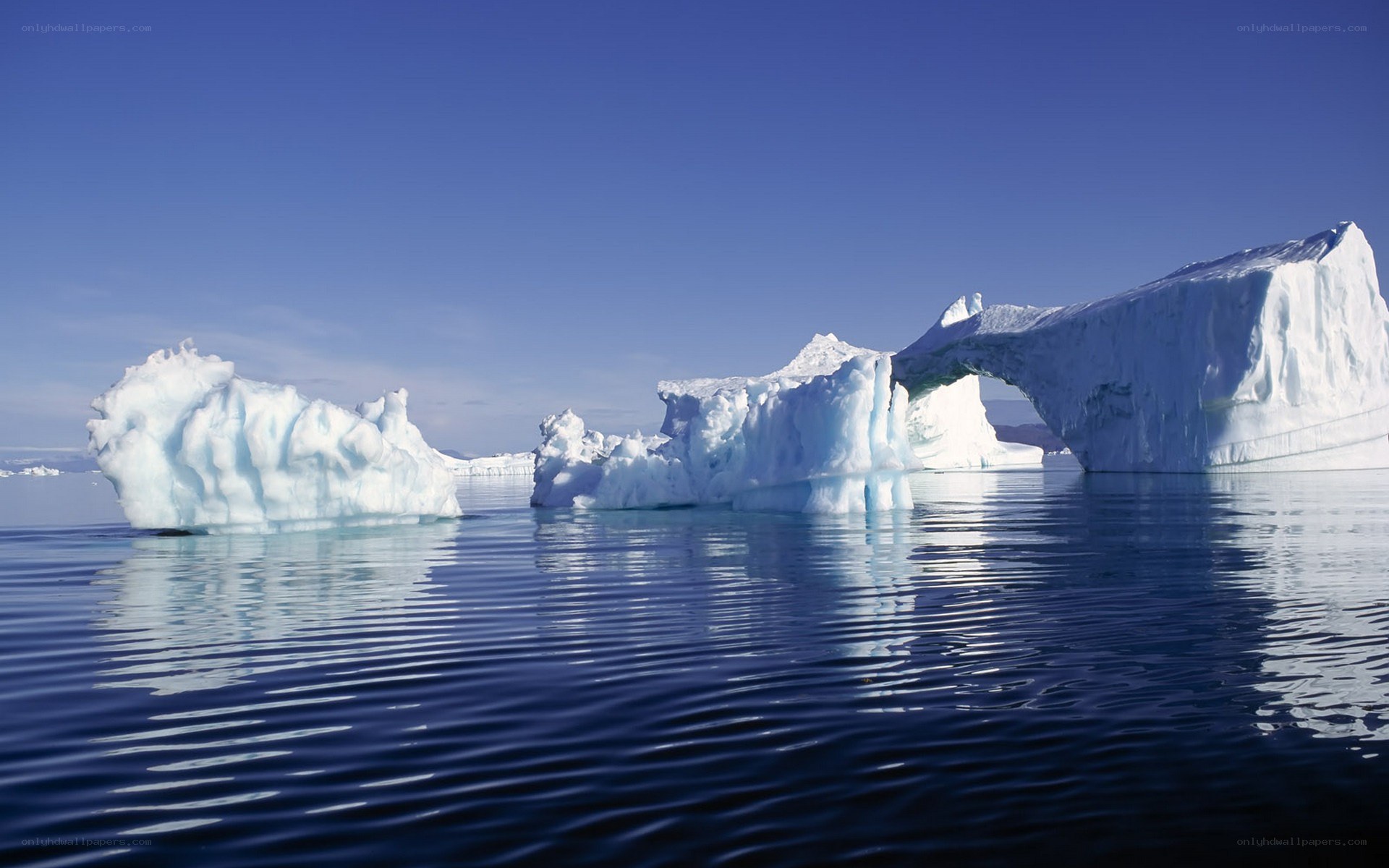 Icebergs floating in calm water