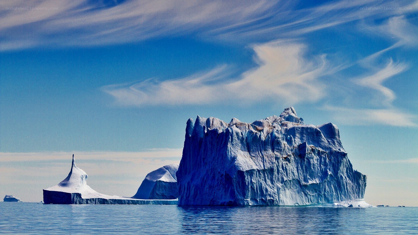 Icebergs floating in calm waters