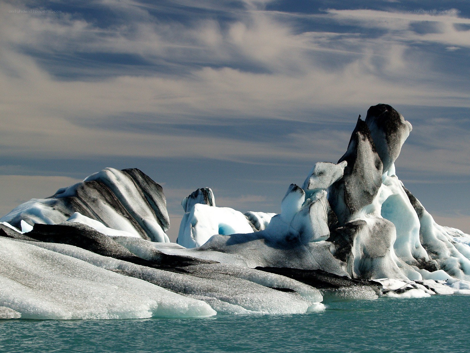 Icebergs floating in turquoise water
