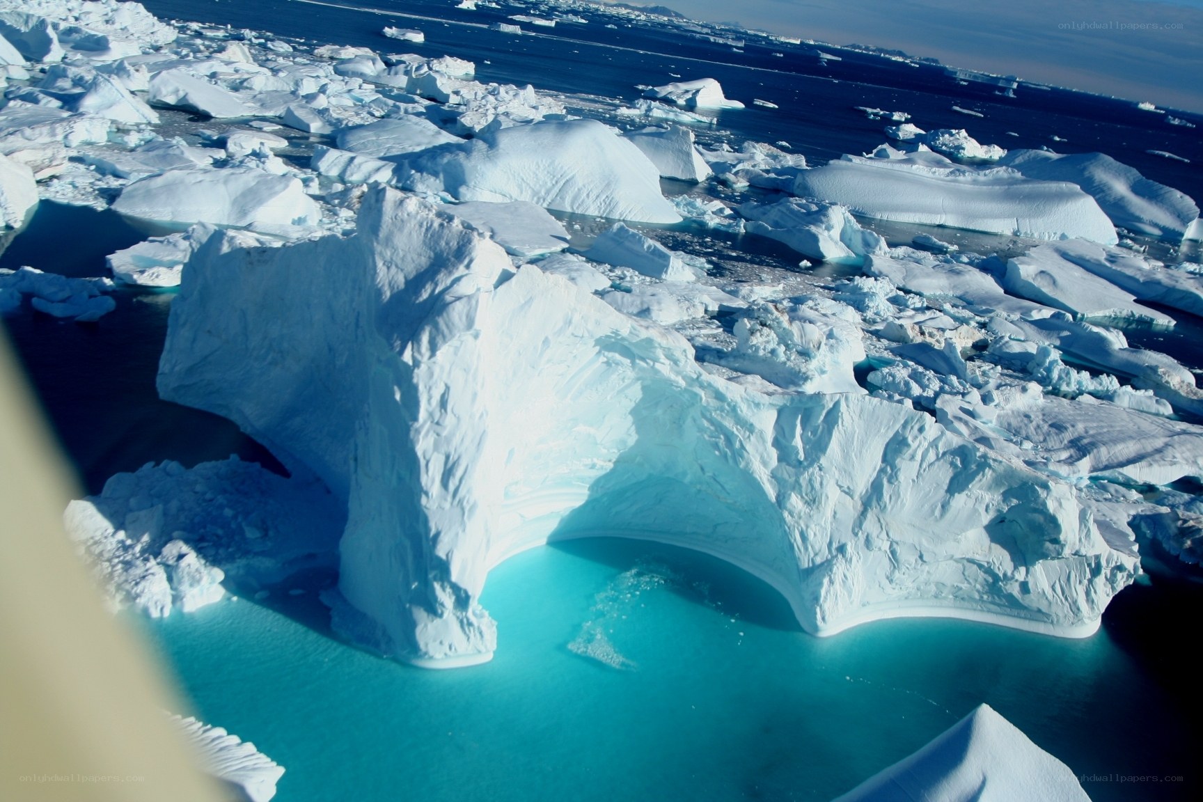 Icebergs floating in turquoise water