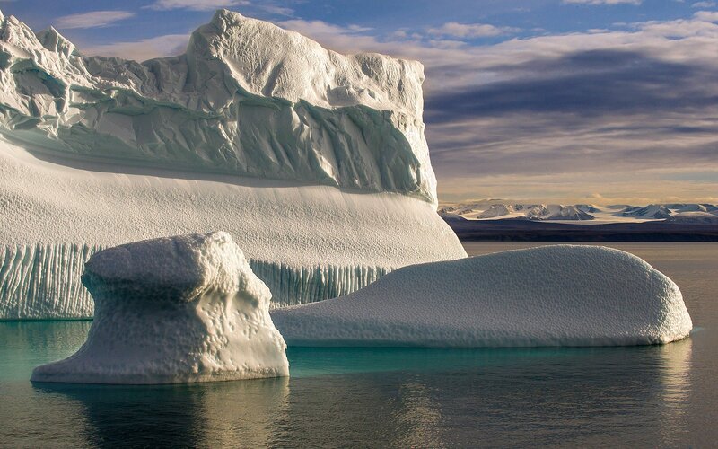 Icebergs Floating in Water — White