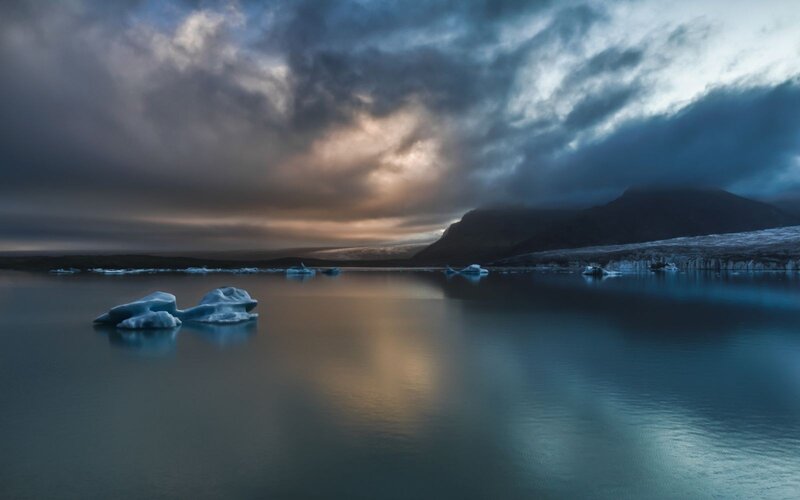 Icebergs in a calm fjord