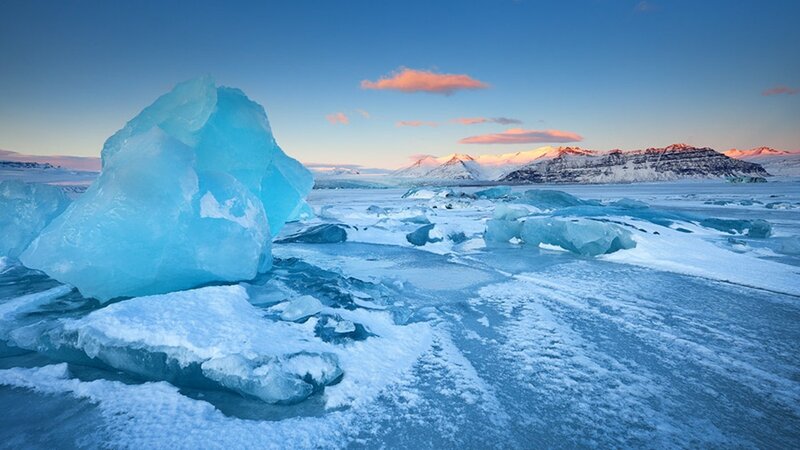 Icebergs in a frozen landscape