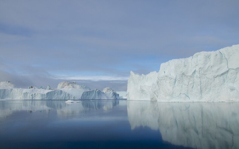 Icebergs in Calm Water — Blue, Serene, Photograph, Sky, Clouds
