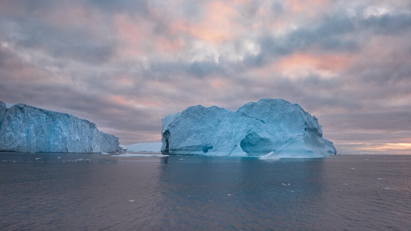 Icebergs in Calm Water — Blue, Serene, Sunset, Photograph, Clouds, Ocean