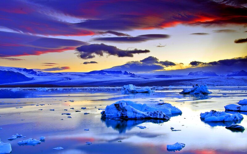 Icebergs in Glacial Lagoon — Blue, Dramatic, Sunset, Photograph