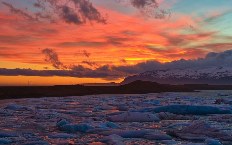 Icebergs in Lagoon — Orange, Dramatic