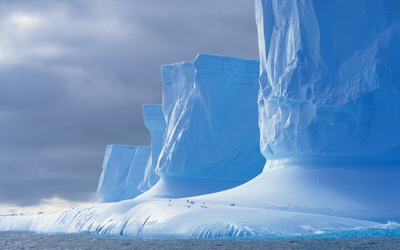Icebergs in Ocean — Blue, Dramatic, Photograph, Clouds