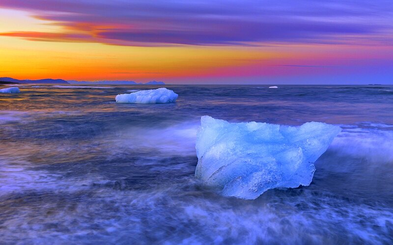 Icebergs in Ocean — Blue, Dramatic, Sunset, Photograph