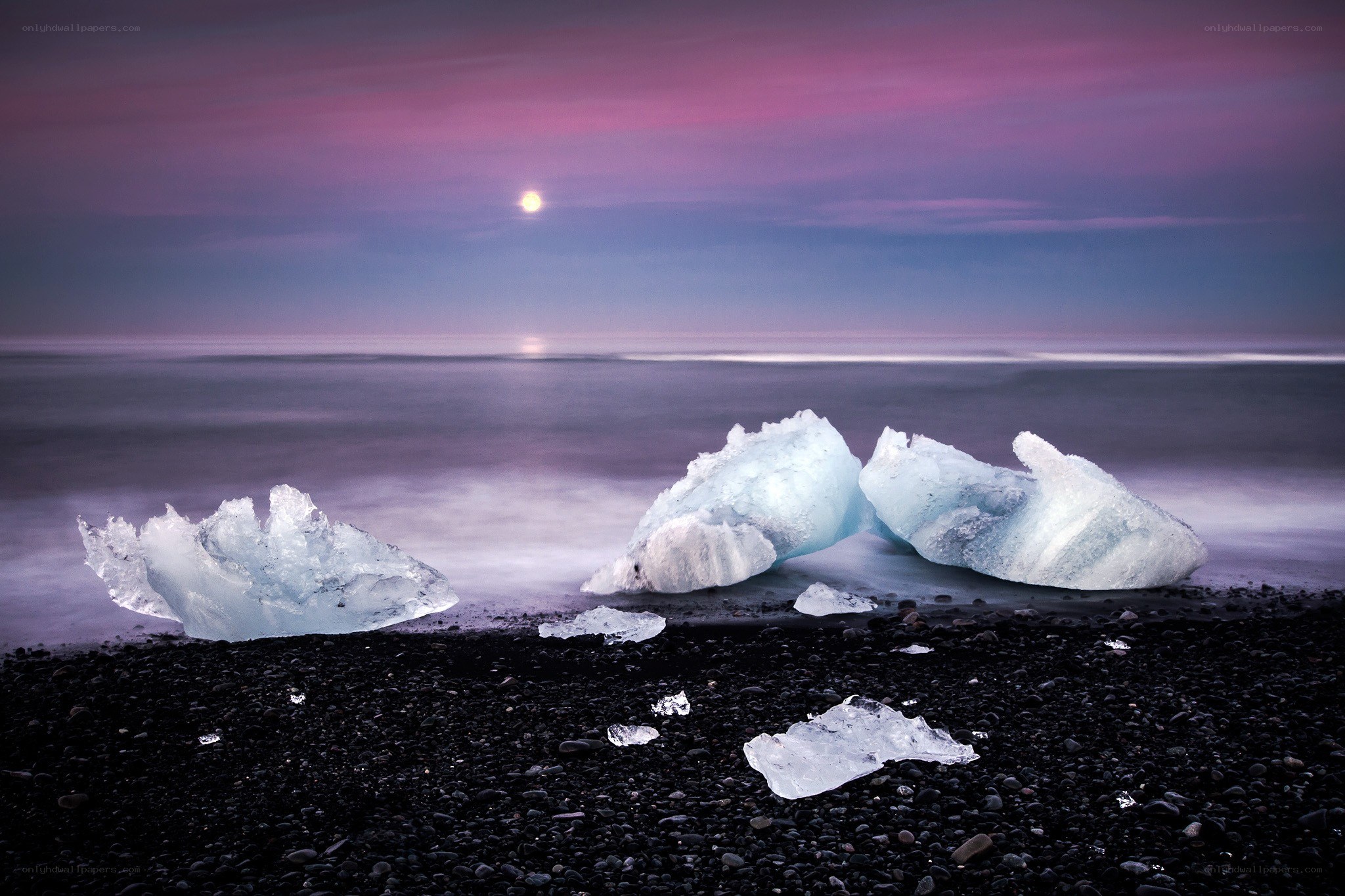 Icebergs on a black sand beach