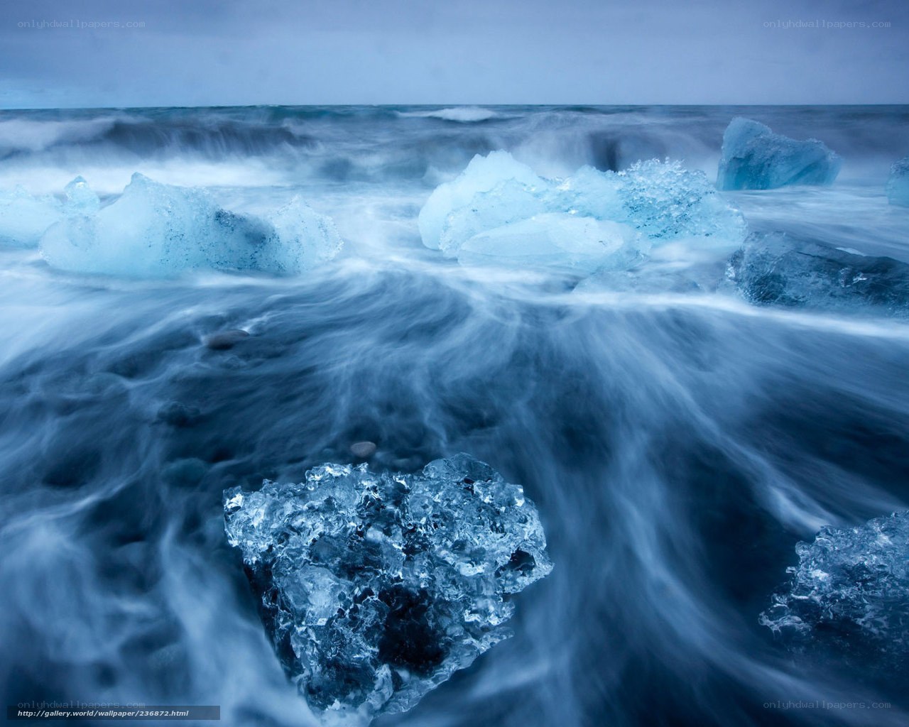Icebergs on a stormy shore