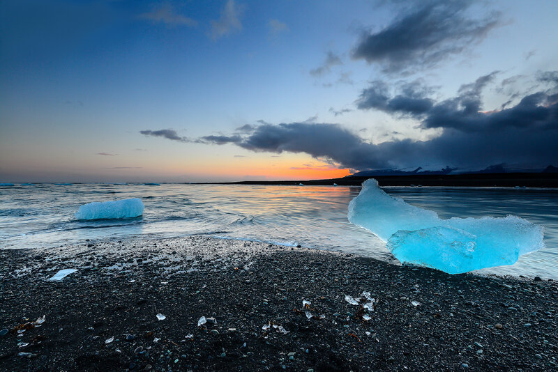 Icebergs on Black Sand Beach — Blue, Dramatic, Sunset