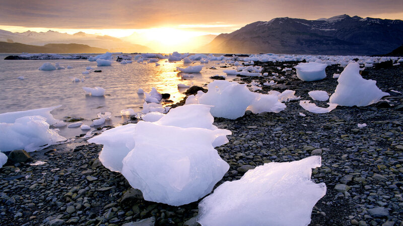 Icebergs on Rocky Shore — White, Serene, Sunset