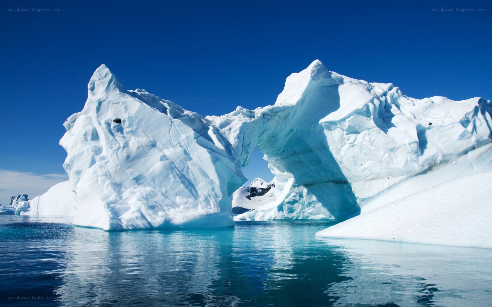 Icebergs with natural arch