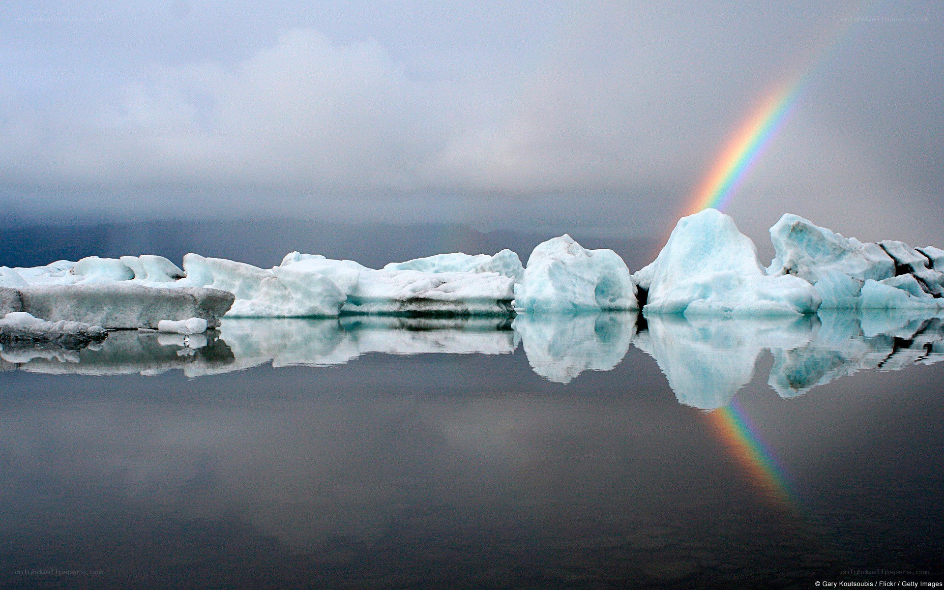 Icebergs with rainbow reflection
