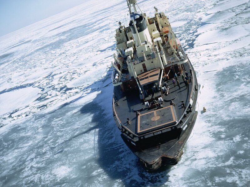 Icebreaker ship in frozen sea
