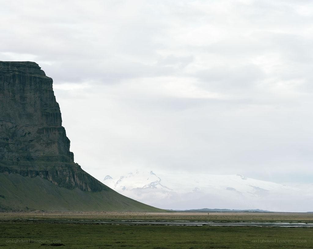Icelandic landscape with cliffs and glacier