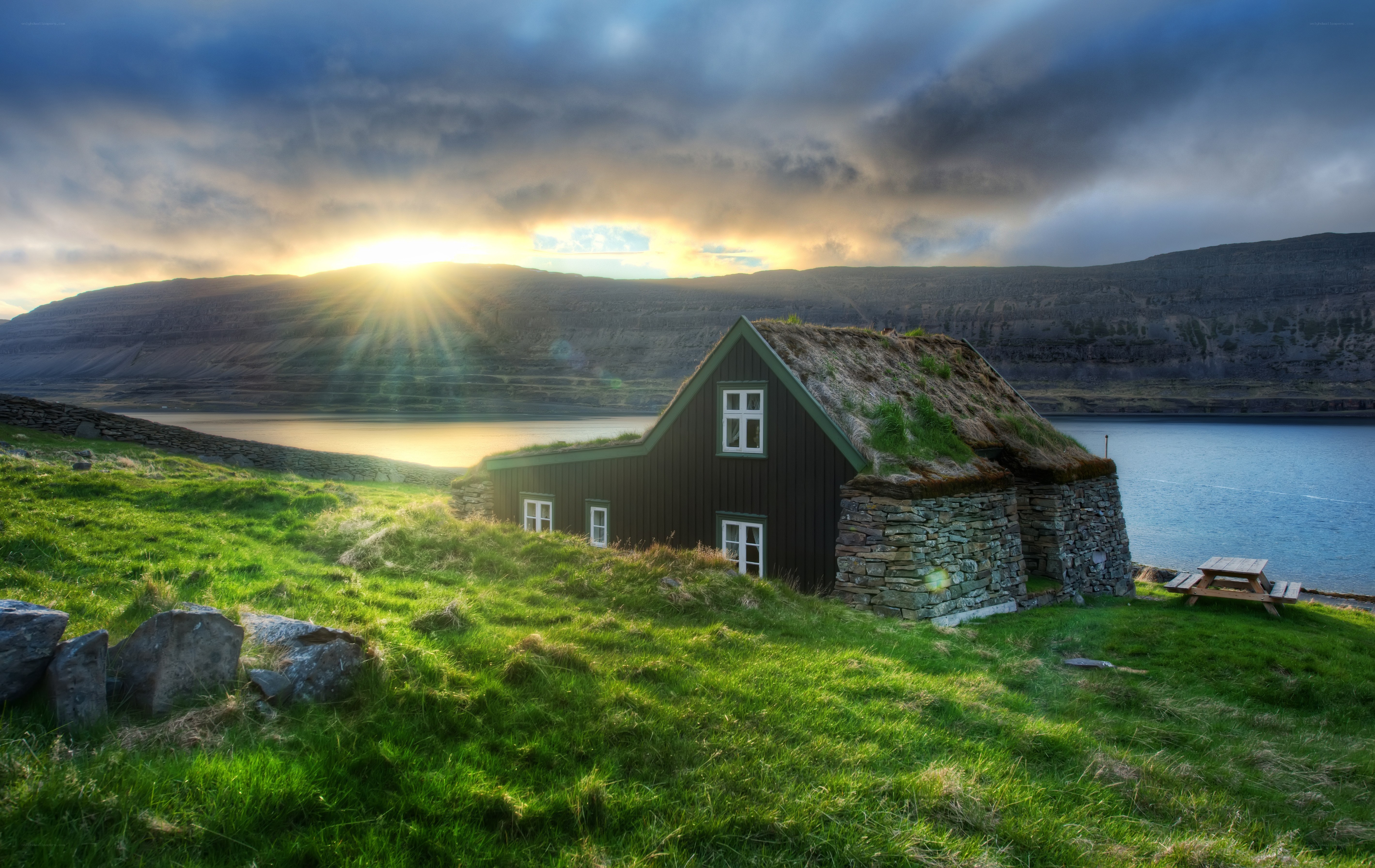Icelandic turf house at sunset