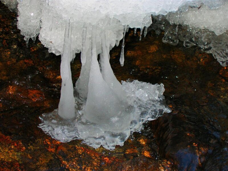 Icicles hanging from a rock