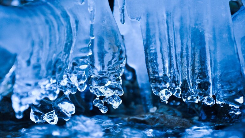 Icicles Hanging from Rock