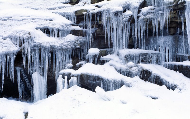 Icicles on a snowy cliff
