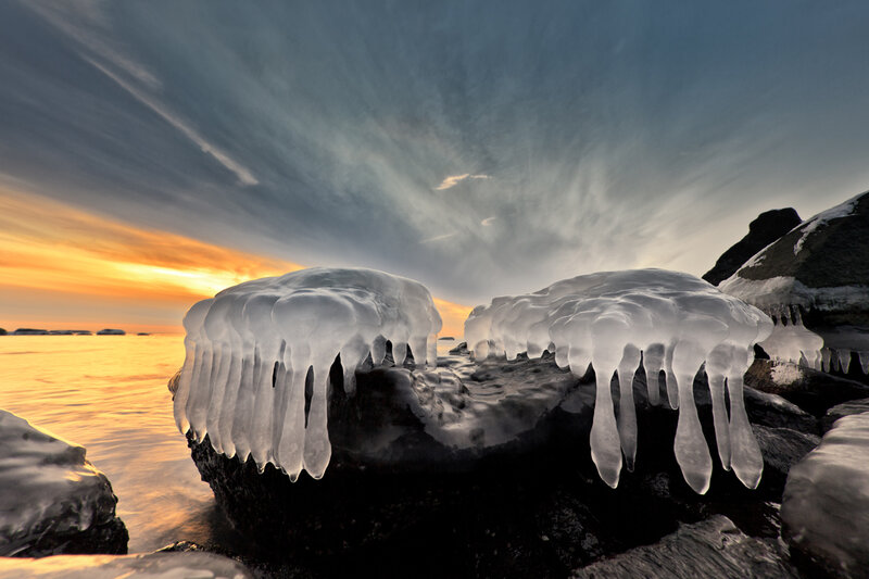 Icicles on Rocks at Sunset