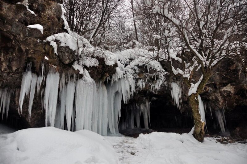 Icicles on Rocky Cliff — White, Cold