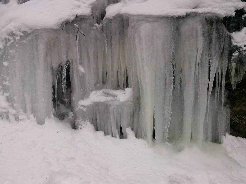 Icicles on Snowy Cliff
