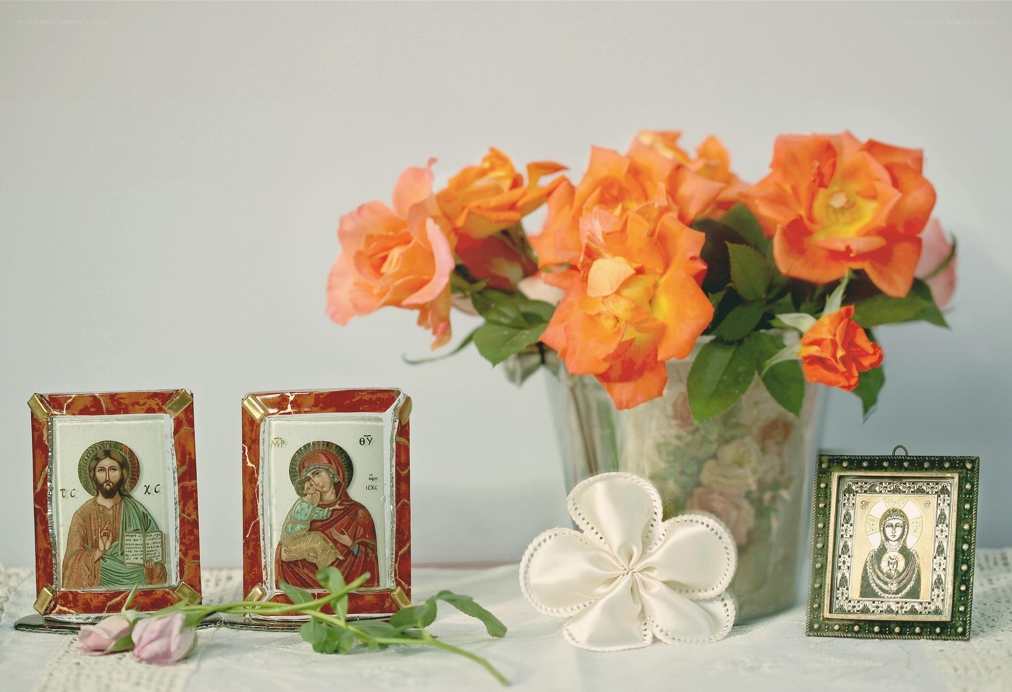 Icons and roses on a table